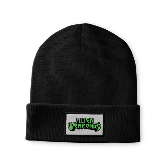 A black cuffed beanie with a sewn patch featuring the Alien Weaponry logo on the front.